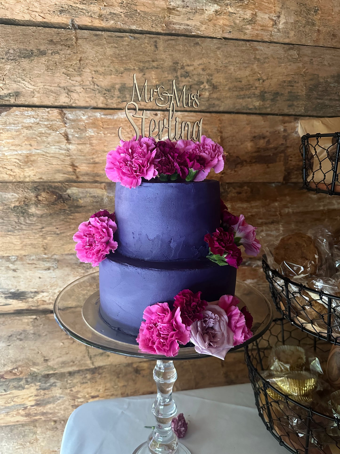 Maple cake topper on top of wedding cake