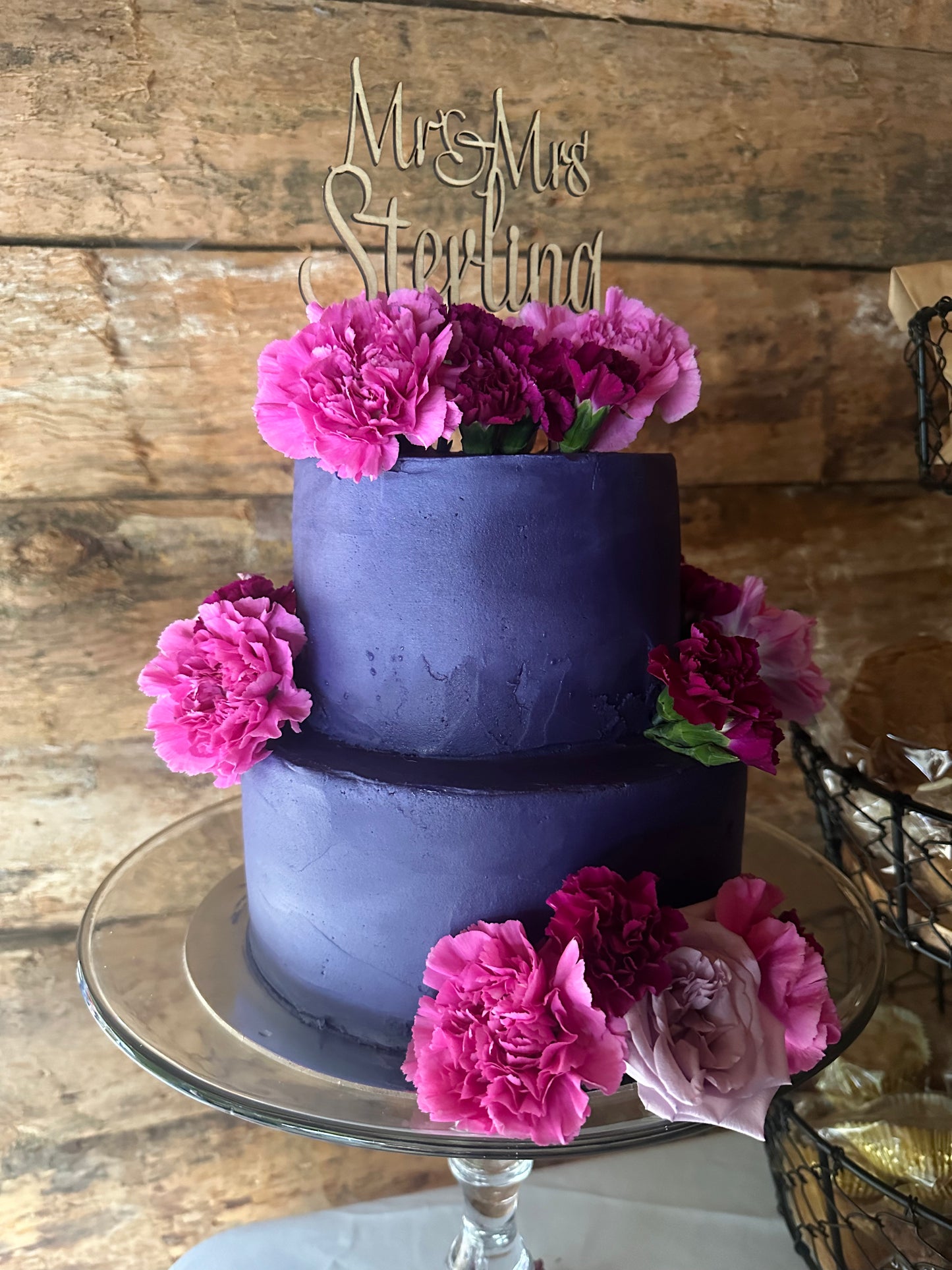 Maple cake topper on top of wedding cake